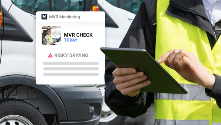 A person in a high-visibility vest holds a tablet showing MVR CHECK with an alert for RISKY DRIVING, highlighting the importance of fleet safety policy. Vans are parked in the background.